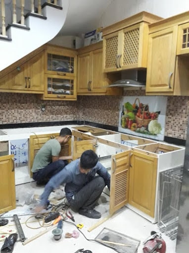 sửa chữa thay bản lề tủ bếp